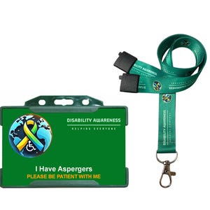 May include: A green lanyard and ID holder set. The lanyard is teal with the words "DISABILITY AWARENESS" printed on it. The ID holder is green with the text "I Have Aspergers PLEASE BE PATIENT WITH ME". The set promotes disability awareness.