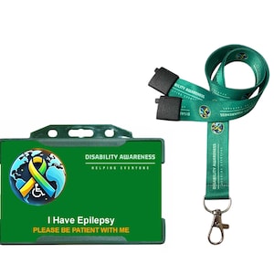 May include: Green lanyard and ID badge holder for disability awareness. The badge holder has the text "I Have Epilepsy, Please Be Patient With Me." The lanyard and badge holder feature a logo with a ribbon and wheelchair symbol.