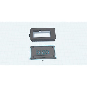 May include: Two-piece, dark gray electronic device enclosure. The top piece is rectangular with a large opening and a small knob. The bottom piece is rectangular with the word "bico" cut out. The pieces are designed to fit together.
