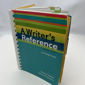 May include: A teal blue book with the title "A Writer's Reference, Seventh Edition with Exercises" by Diana Hacker and Nancy Sommers. The book has yellow and orange striped covers with colorful tabs.