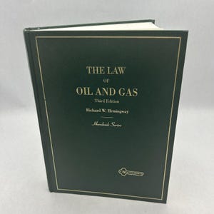 May include: A green hardcover book titled "The Law of Oil and Gas" by Richard W. Hemingway. The book is part of the Hornbook Series and is the third edition.