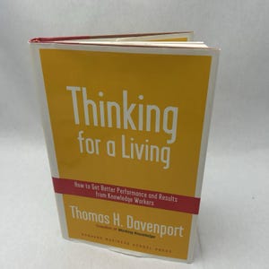May include: A hardcover book titled "Thinking for a Living" with a yellow cover and white text. The book also has a red band with white text. The author is Thomas H. Davenport.