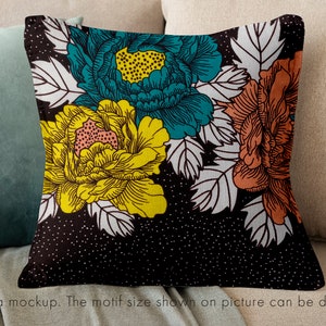May include: A black and white floral pillow with teal, yellow, and orange flowers. The pillow has a white background with black polka dots.