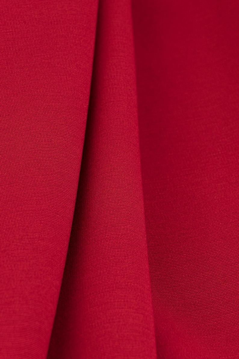 Cherry red ponte knit jersey fabric with soft drape, perfect for structured T-shirts, loungewear and skirts