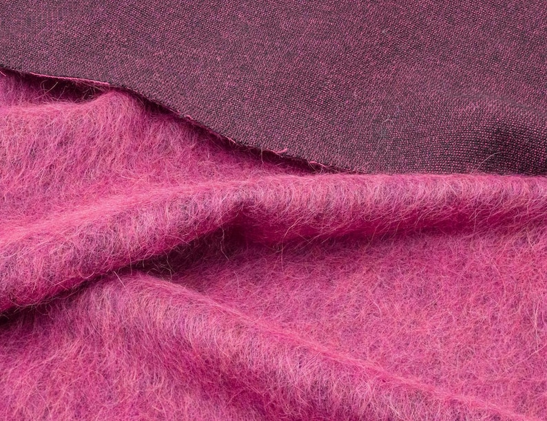 Soft fabric blend with wool, alpaca, and mohair, featuring a bold pink color.
