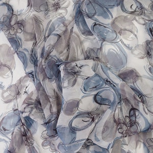 May include: Abstract floral print fabric in shades of blue, grey, and white. The fabric has a sheer, lightweight texture.