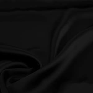 May include: A smooth, black fabric with soft folds and wrinkles. The fabric has a luxurious, silky texture.