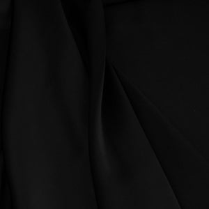 May include: Black fabric with smooth, flowing folds. The fabric has a soft, luxurious feel.