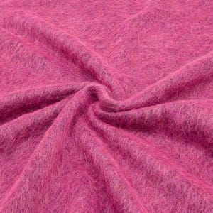 Vibrant pink Italian wool blend fabric with fluffy texture and soft lightweight drape.