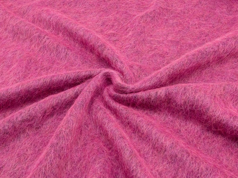Vibrant pink Italian wool blend fabric with fluffy texture and soft lightweight drape.