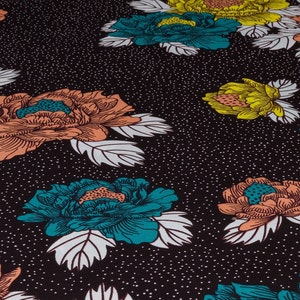 May include: Black fabric with a repeating pattern of teal, orange, and yellow flowers. The flowers have white outlines and are set against a black background with white dots.
