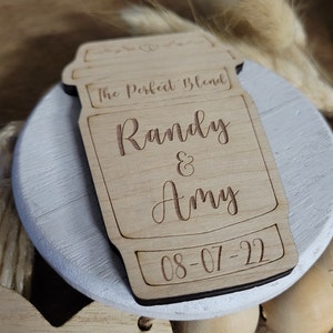 May include: A wooden coffee cup cutout with the text "The Perfect Blend" and the names "Randy & Amy" and the date "08-07-22".
