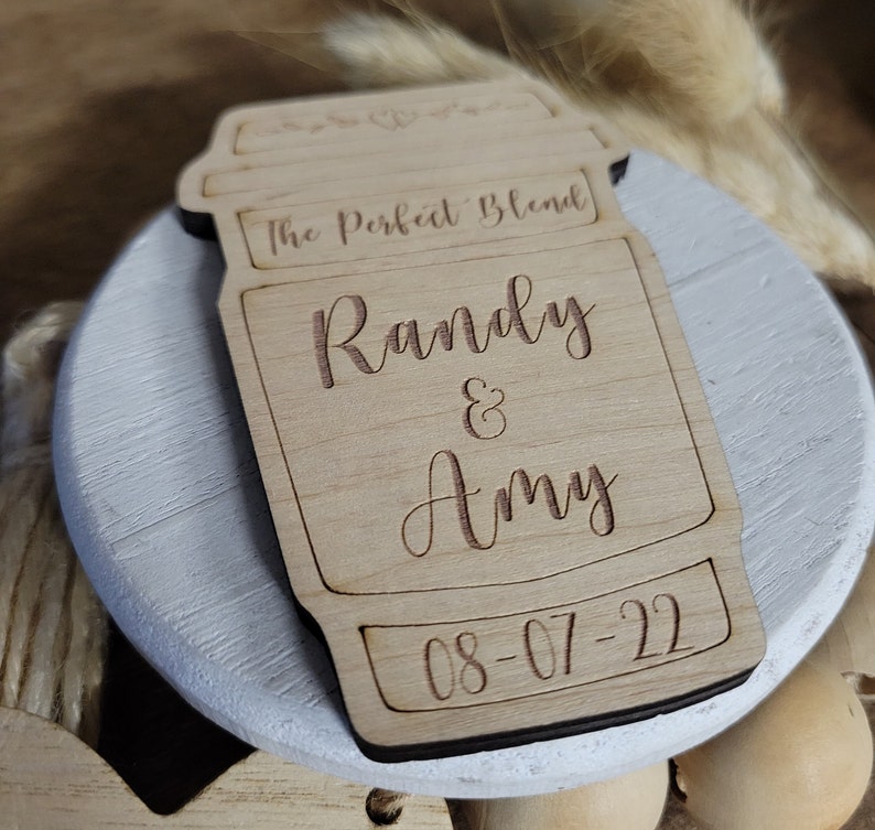 May include: A wooden coffee cup cutout with the text "The Perfect Blend" and the names "Randy & Amy" and the date "08-07-22".