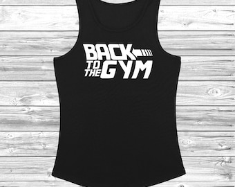 May include: Black tank top with white text that reads "Back to the Gym" with an arrow pointing to the right.