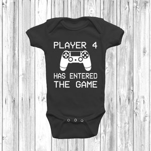 May include: Black baby grow with white text that reads "Player 4 Has Entered The Game" and a white graphic of a video game controller.
