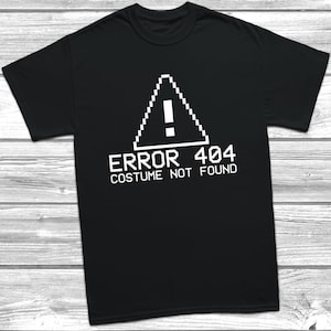 May include: Black t-shirt with a white pixelated warning sign and the text "ERROR 404 COSTUME NOT FOUND".