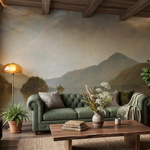 May include: A living room featuring a large wall mural of a mountain lake landscape, a tufted green sofa, a wooden coffee table with a vase of dried flowers, a brown leather lounge chair with an ottoman, and several potted green plants.
