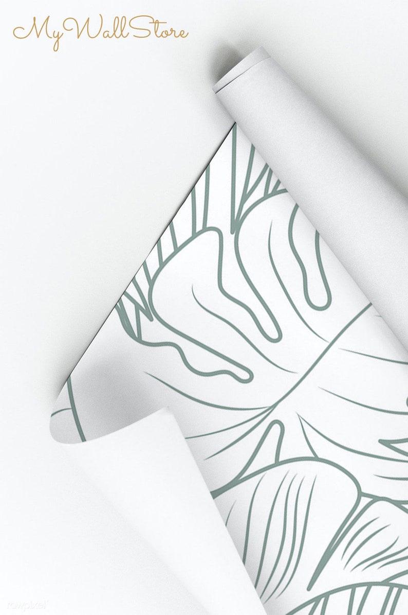 Puede incluir: Un rollo de papel tapiz blanco con un dibujo de hojas tropicales en l&iacute;nea verde. El texto "My Wall Store" es visible en la parte superior de la imagen.