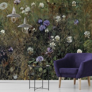 May include: A vintage-style floral wallpaper featuring a close-up of a field of purple and white flowers. The wallpaper is set against a dark green and brown background. A purple armchair and a black metal side table are in the foreground.