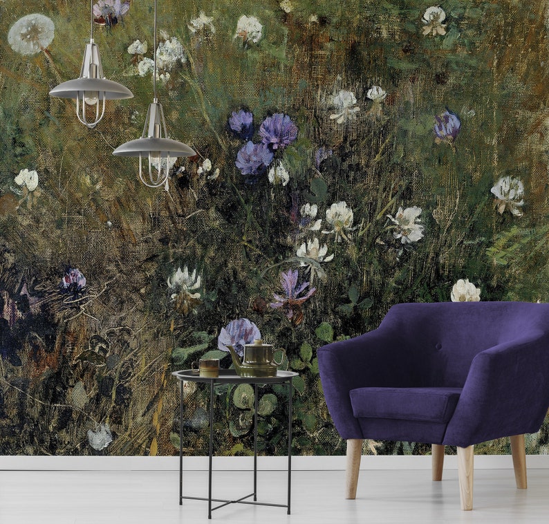May include: A vintage-style floral wallpaper featuring a close-up of a field of purple and white flowers. The wallpaper is set against a dark green and brown background. A purple armchair and a black metal side table are in the foreground.