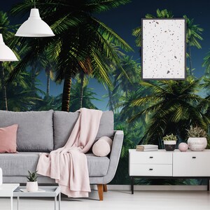 May include: A living room interior with a gray sofa, a white coffee table, and a white dresser. The wall is decorated with a tropical palm tree mural.