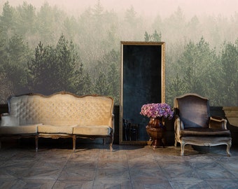 May include: A living room interior with a large, framed mirror, a beige sofa, and a brown armchair. The wall behind the furniture is covered with a wallpaper depicting a misty forest scene.