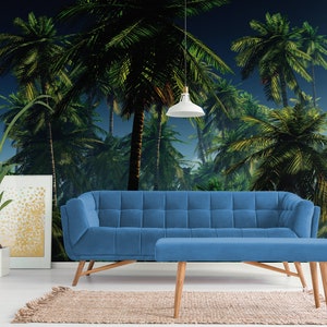 May include: A blue velvet sofa and matching ottoman in front of a tropical palm tree mural. The mural features a dark blue sky with green palm trees.