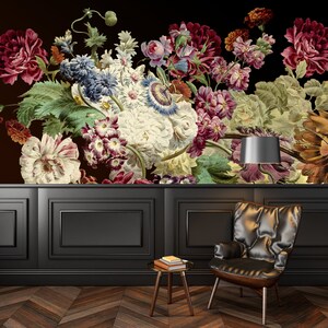 May include: A black and white photo of a floral arrangement with a black background. The flowers are in a vase and are arranged in a symmetrical pattern. The photo is taken from a low angle, so the flowers appear to be towering over the viewer.