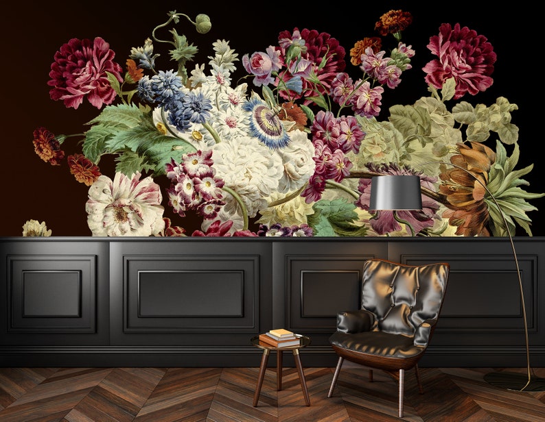 May include: A black and white photo of a floral arrangement with a black background. The flowers are in a vase and are arranged in a symmetrical pattern. The photo is taken from a low angle, so the flowers appear to be towering over the viewer.