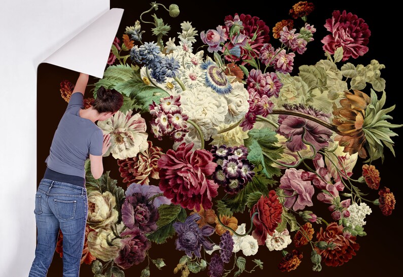May include: A close-up of a floral wallpaper with a variety of flowers in shades of red, pink, purple, white, and green. The flowers are arranged in a bouquet and are set against a dark background.