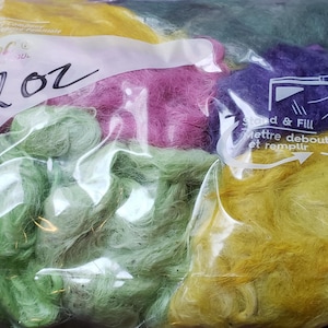 May include: A clear plastic bag filled with 2 oz of colorful fiber. The fiber is in shades of green, yellow, pink, and purple. The bag has a label that says "Stand & Fill" and "Mettre debout et remplir".