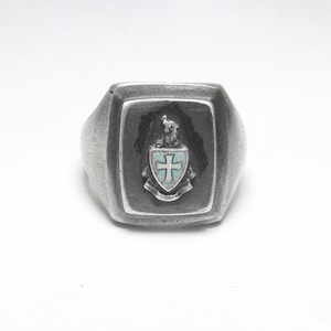 May include: A set of three ceramic mugs with a speckled, matte finish. The mugs are in shades of cream, light gray, and dark gray. Each mug has a simple, minimalist design and a rounded handle.