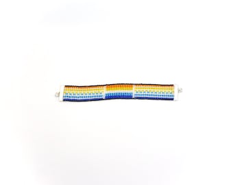 Aroace: an aromantic/asexual pride flag loom beaded bracelet