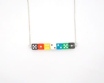 Disability Pride: A pride necklace rendered in dice