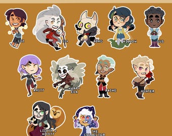 May include: A collection of The Owl House stickers featuring various characters like Luz, Eda, King, Willow, Gus, Amity, Harpy Eda, Raine, Hunter, Lilith + Hooty, and The Collector. The stickers are colorful and cartoon-style, with a brown background.
