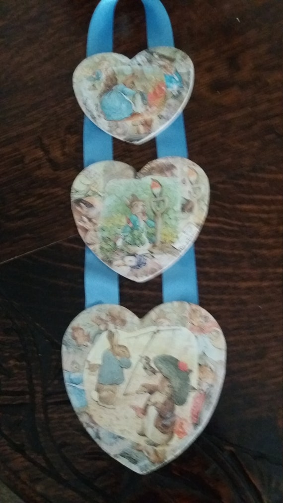 Peter Rabbit decoupaged triple wooden hanging heart set. Featuring Beatrix Potter characters. Perfect for a nursery