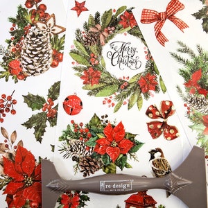 Peut inclure: Un ensemble de feuilles de découpage sur le thème de Noël avec une variété d'images, notamment des poinsettias, des pommes de pin, des oiseaux, du houx, des nœuds et une couronne avec le texte "Joyeux Noël".