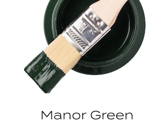 May include: A small jar of Manor Green Fusion Mineral Paint with a paintbrush dipped in the paint. The paint is a deep green color.
