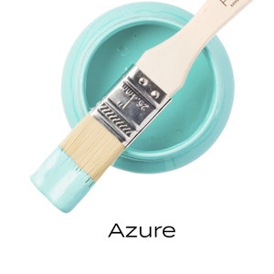 May include: A small jar of turquoise blue Fusion Mineral Paint with a paintbrush dipped in the paint. The jar is labeled "Fusion Mineral Paint" and the color is "Azure".