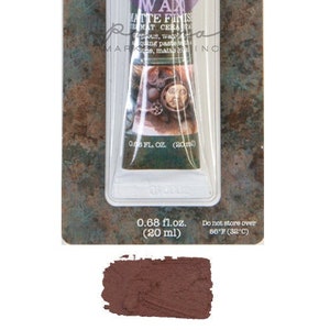 May include: A tube of Art Alchemy Wax Matte Finish in Stained Wood. The tube is 0.68 fl. oz. (20 ml) and has a brown, textured label with the brand name and product description.