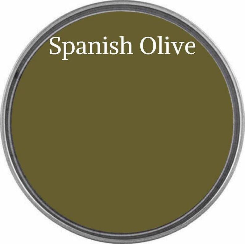 May include: A round paint can lid with the text "Spanish Olive" printed in white on a dark green background.