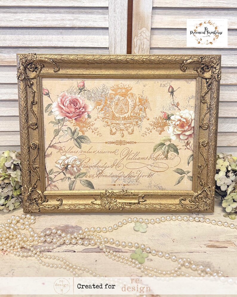 May include: A gold-framed picture with a vintage floral design featuring pink and white roses. The image includes a crest with a shield and two birds. The text "Dollars value received Williams & Brothers" is visible in the image.