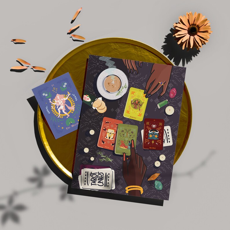 May include: A tarot card reading spread with five cards laid out on a dark patterned surface. The cards are colorful and feature illustrations of people and symbols. The spread is surrounded by candles, crystals, and a cup of tea.