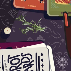 May include: A close-up of a tarot card reading spread with a sprig of rosemary on a dark purple background. The cards are arranged in a circle with the words "Tarot Cards" visible on one of the cards. The card in the center of the spread is the Chariot card.