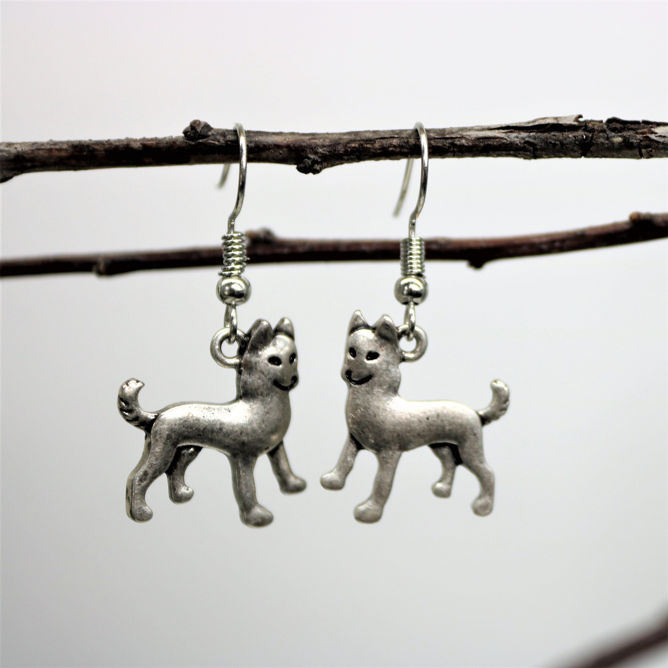 Silver-plated earrings with an image of a pure-bred dog Poodle
