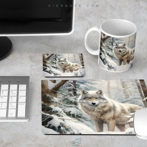 May include: A white ceramic coffee mug with a wolf in a snowy forest scene. The mug is on a white desk with a keyboard, mouse, and two coasters with the same wolf image.