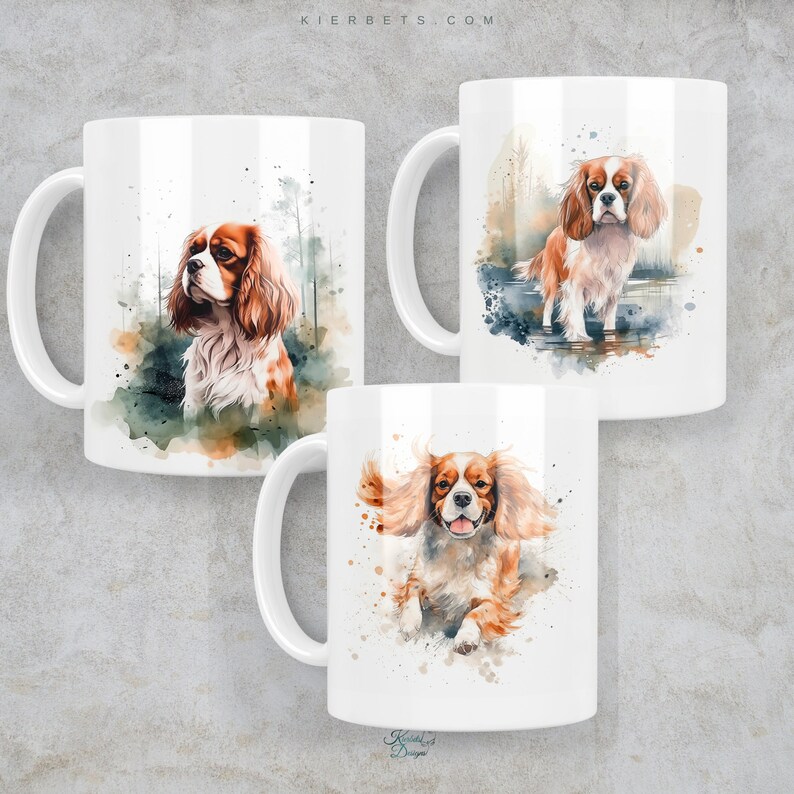 May include: Three white ceramic mugs with watercolor illustrations of Cavalier King Charles Spaniels. The mugs feature different poses of the dogs, including one with a green and brown forest background, one with a blue and brown water background, and one with a white background.