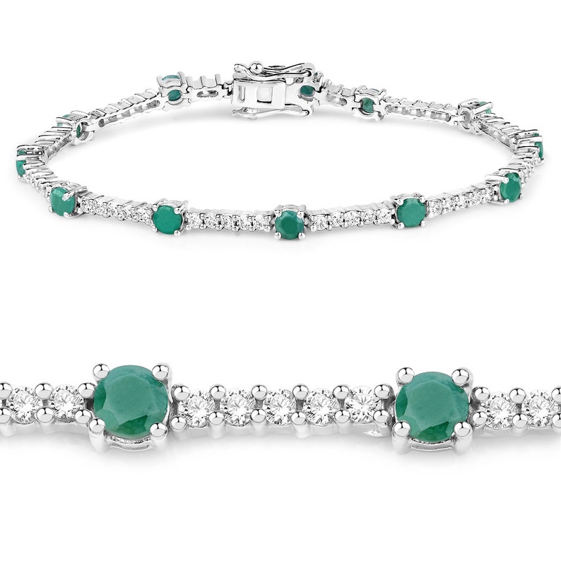 May include: A silver tennis bracelet featuring emerald green gemstones and small clear diamonds.