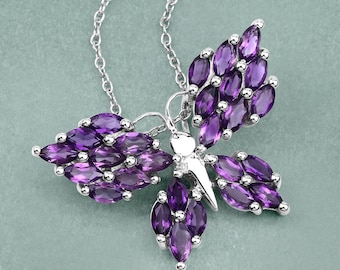 May include: A silver necklace with a butterfly pendant made of purple amethyst stones.
