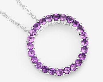 May include: A silver necklace with a circle pendant made of amethyst gemstones.